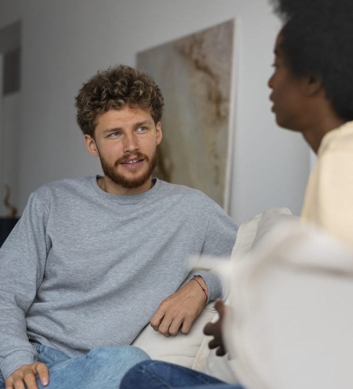 medium-shot-friends-chatting-home